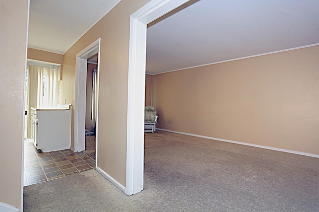 hall with carpet flooring and baseboards