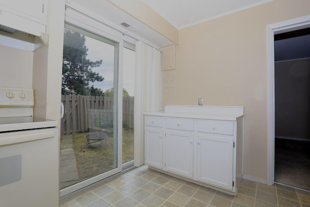 doorway to outside with light tile patterned floors