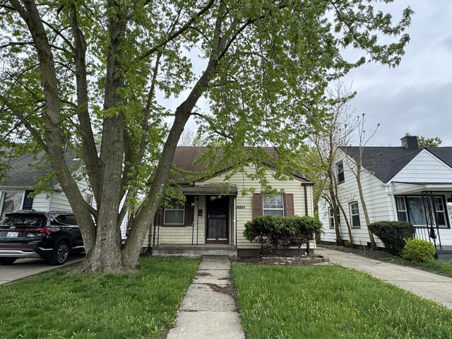 16044 Fairmount Dr, Detroit, MI 48205 - bungalow featuring driveway and a front lawn