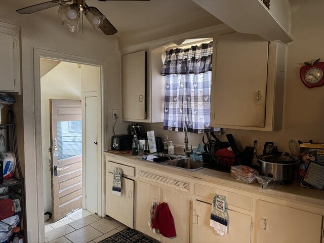 16044 Fairmount Dr, Detroit, MI 48205 - kitchen featuring ceiling fan, light countertops, light tile patterned floors, and a sink
