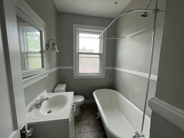 1531 W Warren Ave, Detroit, MI 48208 - full bathroom featuring a soaking tub, plenty of natural light, vanity, and toilet