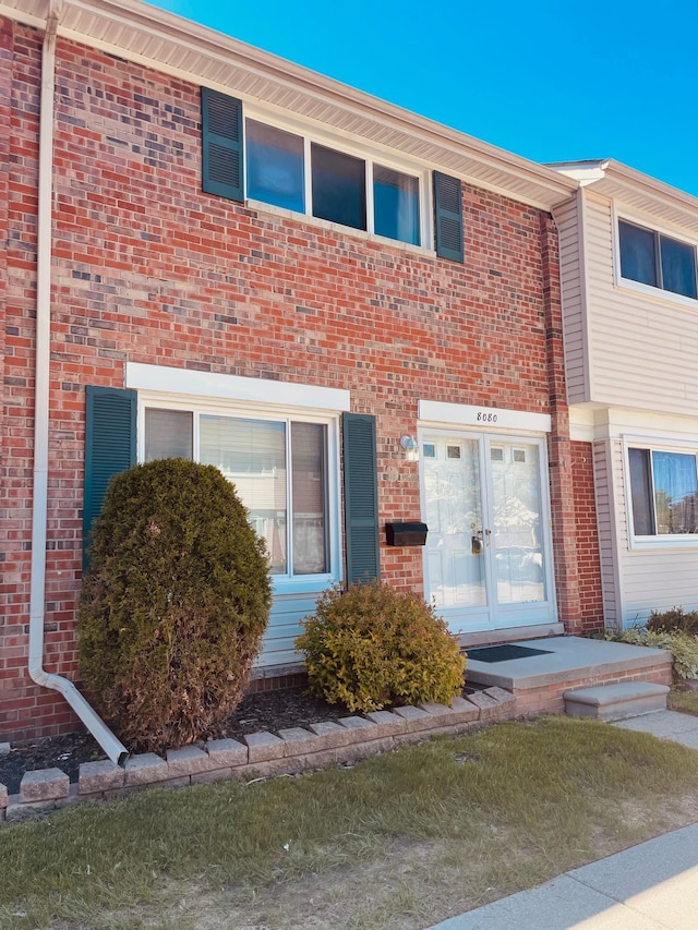 8080 Farnum Ct, Warren, MI 48093 - view of front of house featuring french doors and brick siding