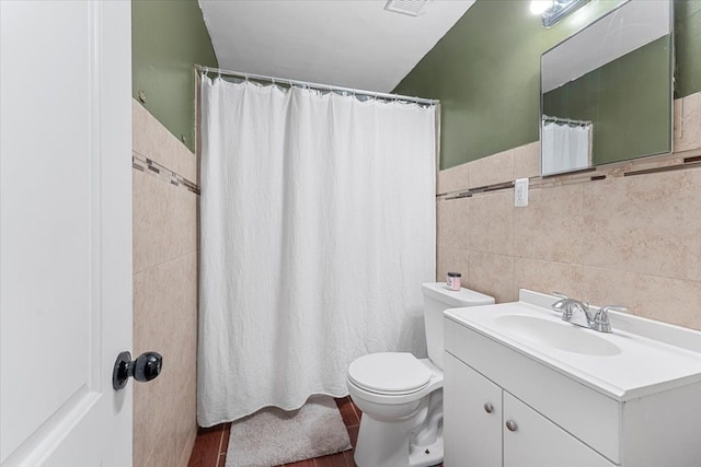 full bath featuring tile walls, vanity, toilet, and a shower with curtain