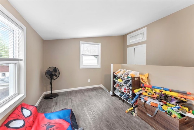 rec room featuring wood finished floors and baseboards