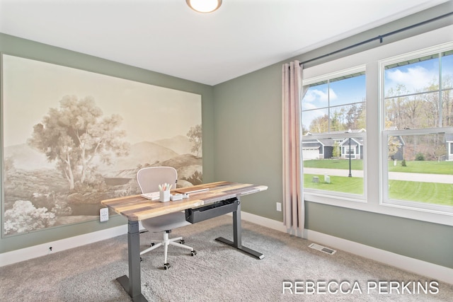 office space with carpet and baseboards