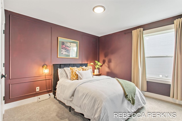 bedroom featuring light colored carpet