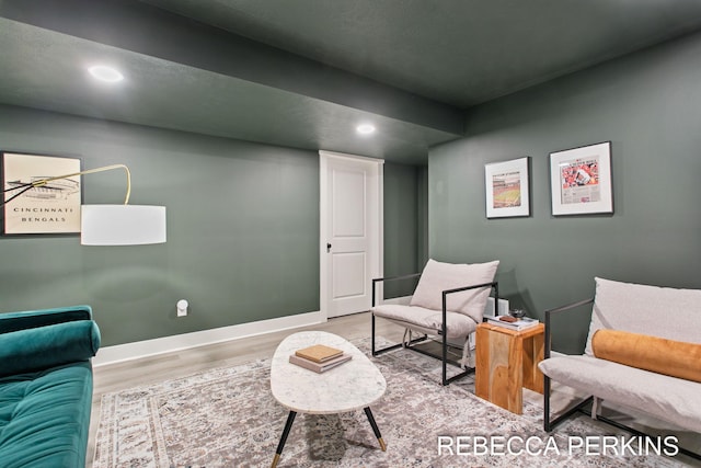 sitting room featuring wood finished floors, recessed lighting, and baseboards