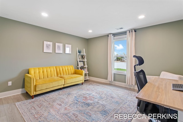 home office with wood finished floors, recessed lighting, and baseboards