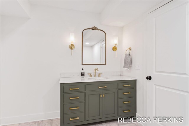 bathroom featuring vanity and baseboards