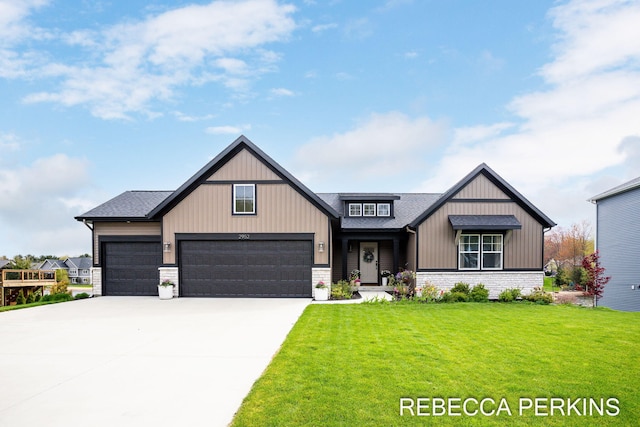 modern farmhouse with a front yard, concrete driveway, a garage, and a shingled roof