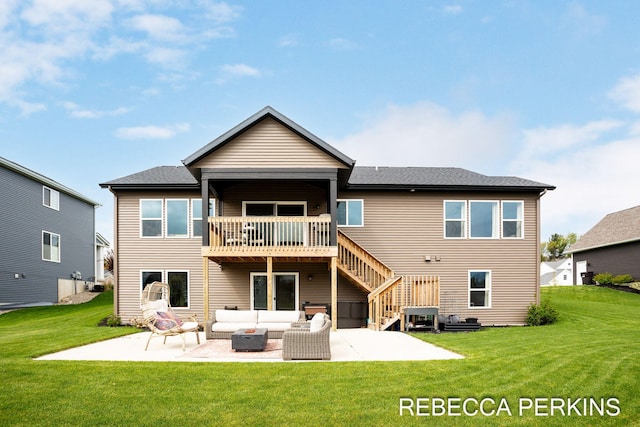 rear view of property featuring an outdoor living space, a patio area, a lawn, and stairway
