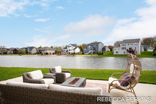view of patio / terrace with a residential view and a water view