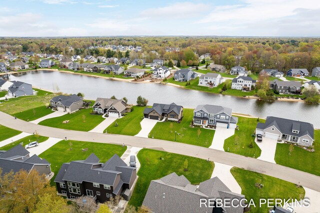 aerial perspective of suburban area featuring a large body of water