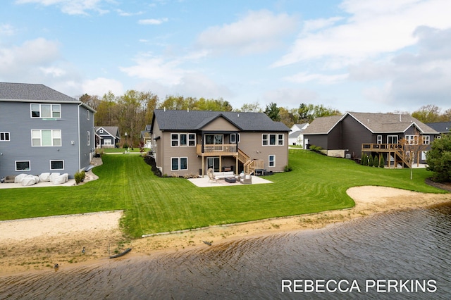 rear view of property with a patio area, a residential view, a deck with water view, and stairway