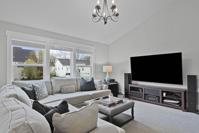living area featuring a chandelier, carpet floors, and high vaulted ceiling