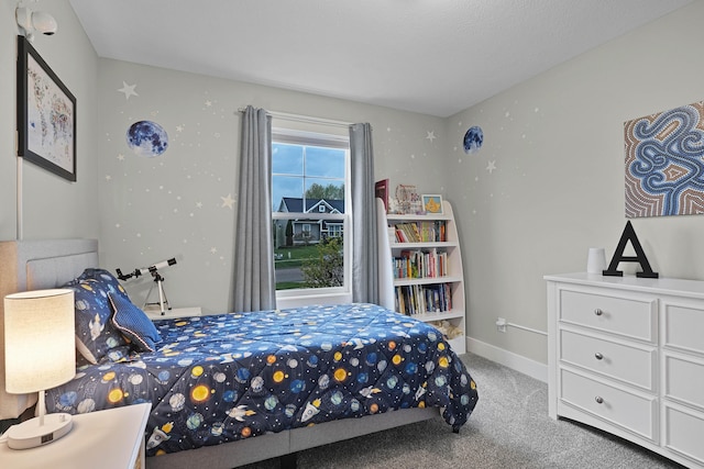 carpeted bedroom with baseboards