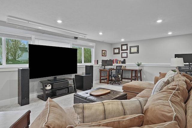 living room with an office area, recessed lighting, and baseboards