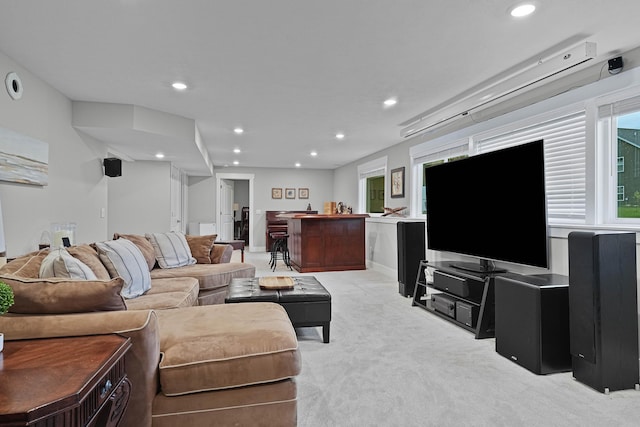 living area with light colored carpet and recessed lighting