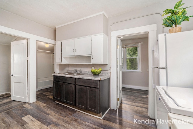 747 Alpine Ave NW, Grand Rapids, MI 49504 - kitchen featuring a sink, light countertops, white cabinets, dark wood-style flooring, and dark brown cabinetry