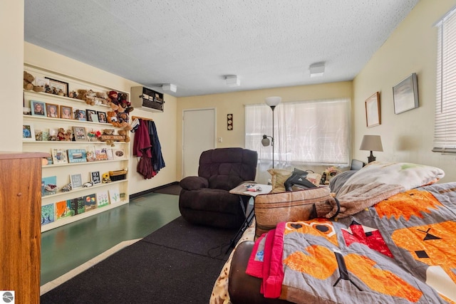 110 W 4th St, Kalkaska, MI 49646 - bedroom with a textured ceiling and a wall mounted AC
