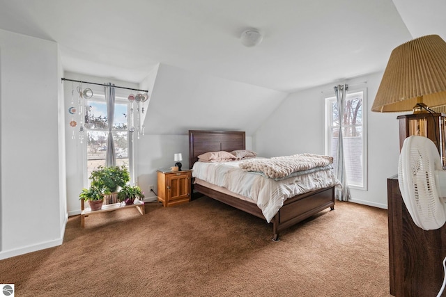110 W 4th St, Kalkaska, MI 49646 - bedroom with carpet, lofted ceiling, and baseboards