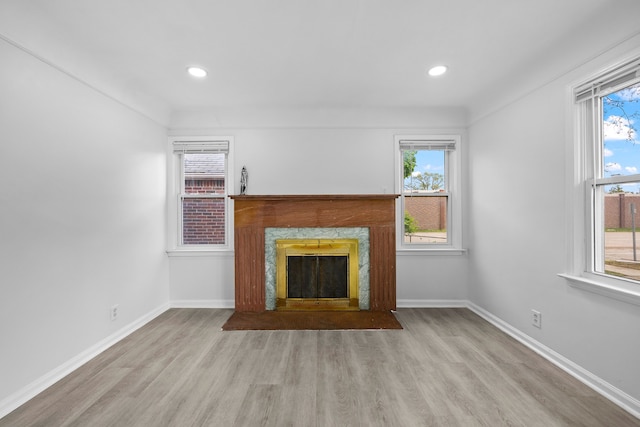 839 E Hayes Ave, Hazel Park, MI 48030 - unfurnished living room featuring wood finished floors, healthy amount of natural light, baseboards, and recessed lighting