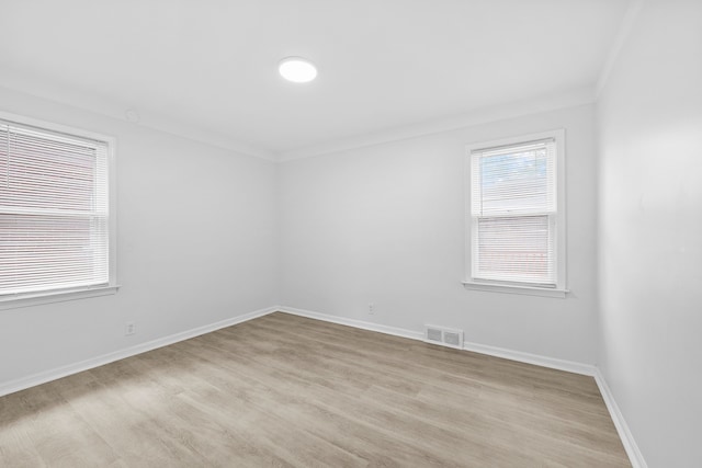 839 E Hayes Ave, Hazel Park, MI 48030 - empty room with light wood-style floors, baseboards, and crown molding