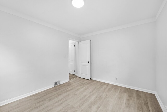 839 E Hayes Ave, Hazel Park, MI 48030 - unfurnished room featuring wood finished floors, baseboards, and ornamental molding