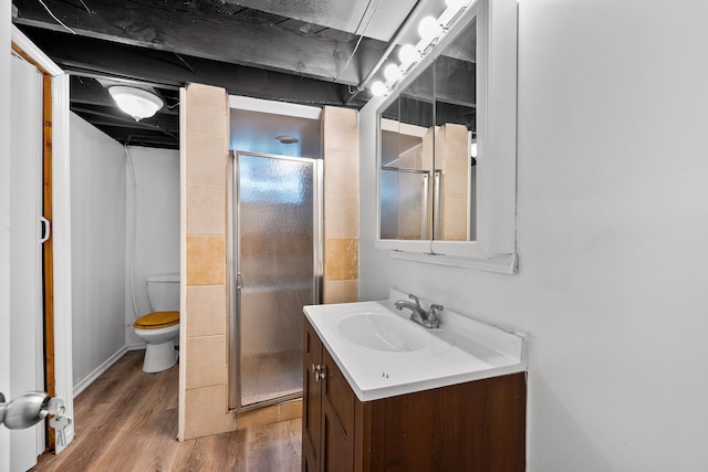 839 E Hayes Ave, Hazel Park, MI 48030 - full bathroom featuring vanity, a stall shower, wood finished floors, and toilet