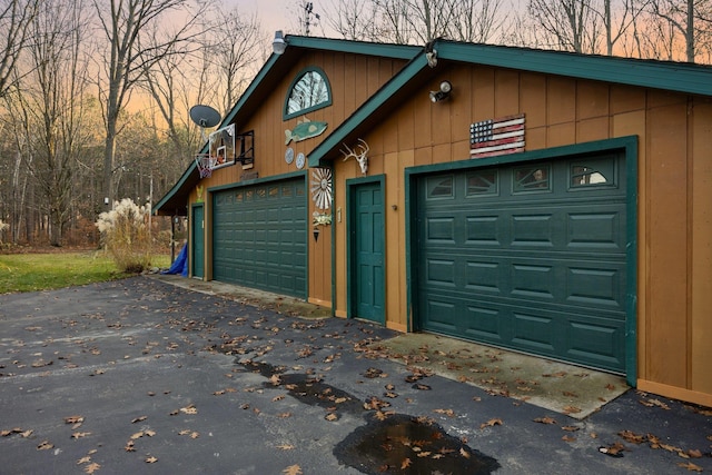 garage featuring driveway