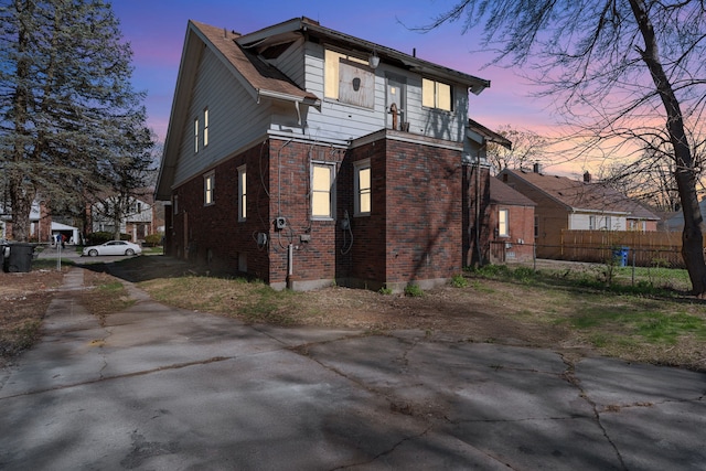 11323 Bramell, Redford, MI 48239 - view of property exterior featuring brick siding, concrete driveway, and fence
