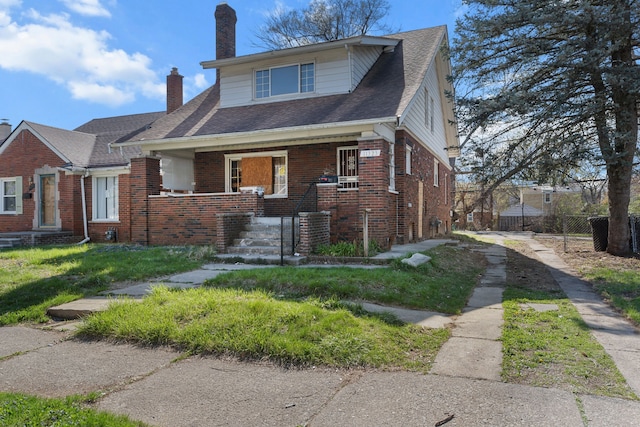 11323 Bramell, Redford, MI 48239 - bungalow-style house featuring brick siding, a chimney, a porch, and fence