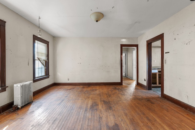 11323 Bramell, Redford, MI 48239 - empty room with radiator, hardwood / wood-style flooring, and baseboards
