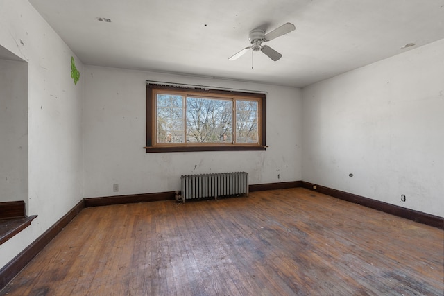 11323 Bramell, Redford, MI 48239 - empty room with radiator, wood-type flooring, a ceiling fan, and baseboards