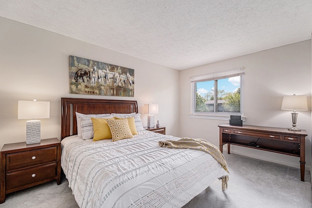 carpeted bedroom featuring a textured ceiling