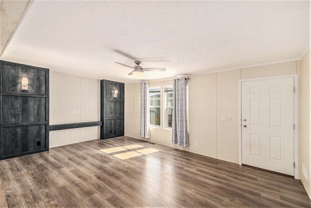 13780 Alaska Ave, Eagle, MI 48822 - unfurnished living room featuring wood finished floors, ceiling fan, and a textured ceiling
