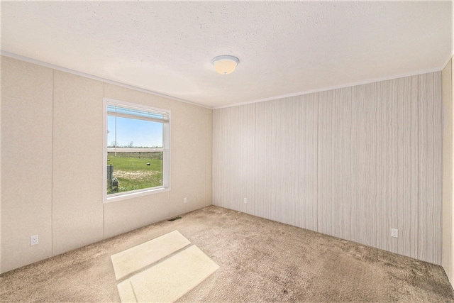 13780 Alaska Ave, Eagle, MI 48822 - carpeted spare room with ornamental molding
