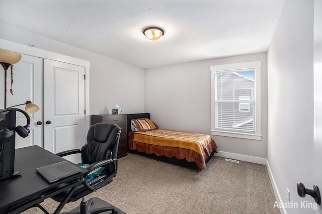 6526 Alward Dr, Hudsonville, MI 49426 - carpeted bedroom with baseboards, an office area, and a closet