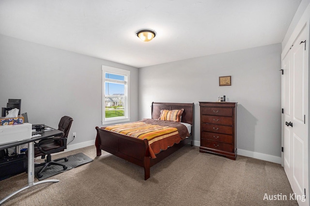 6526 Alward Dr, Hudsonville, MI 49426 - bedroom featuring carpet floors, baseboards, an office area, and a closet