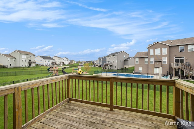 6526 Alward Dr, Hudsonville, MI 49426 - wooden terrace with a residential view and a playground