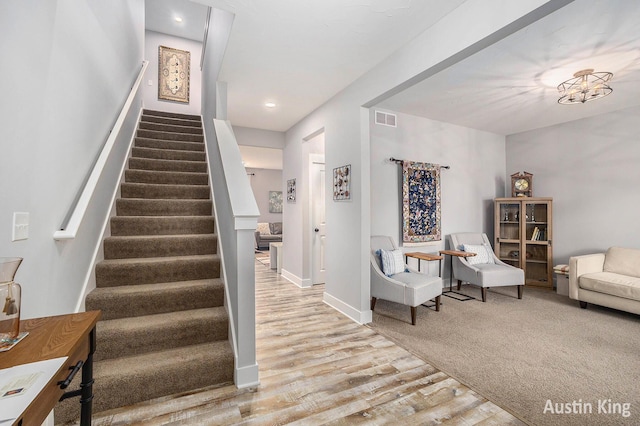 6526 Alward Dr, Hudsonville, MI 49426 - staircase featuring wood finished floors, baseboards, and recessed lighting