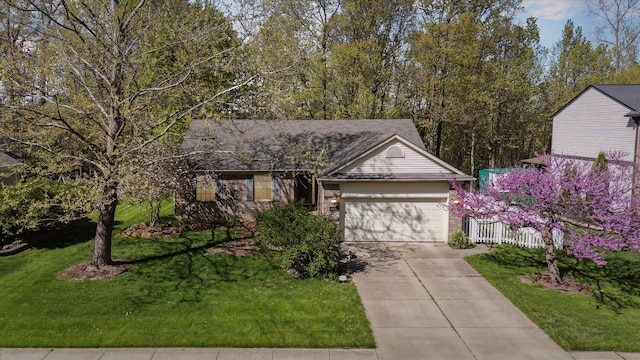 view of front facade featuring an attached garage and concrete driveway