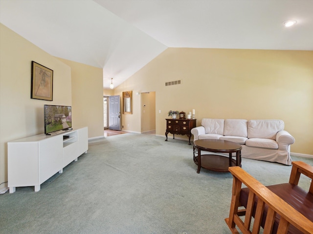 living room featuring vaulted ceiling, light carpet, and baseboards