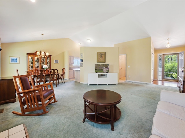 living area with carpet flooring, vaulted ceiling, a chandelier, and baseboards