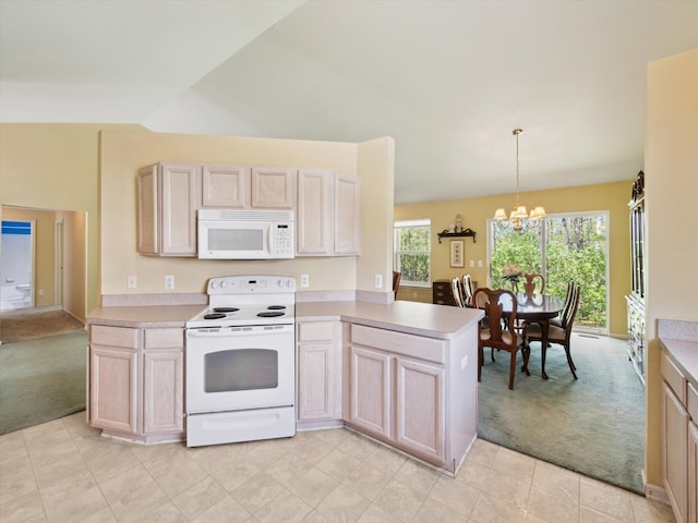 kitchen featuring white appliances, light colored carpet, a chandelier, a peninsula, and light countertops