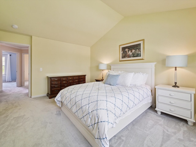 carpeted bedroom featuring vaulted ceiling