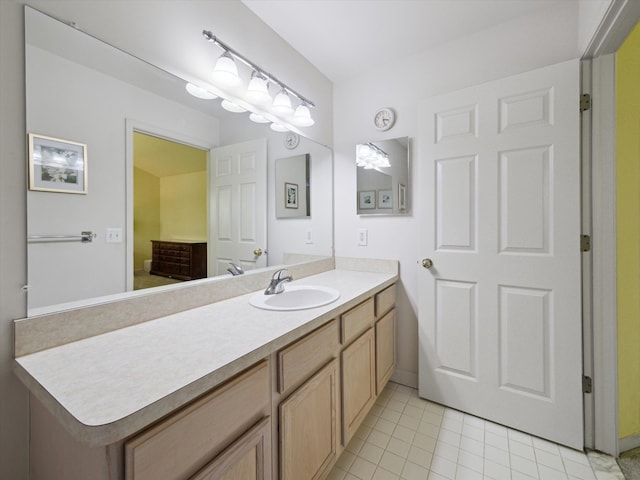 bathroom with tile patterned floors and vanity