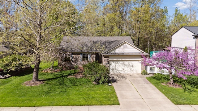 view of front of house with an attached garage and driveway