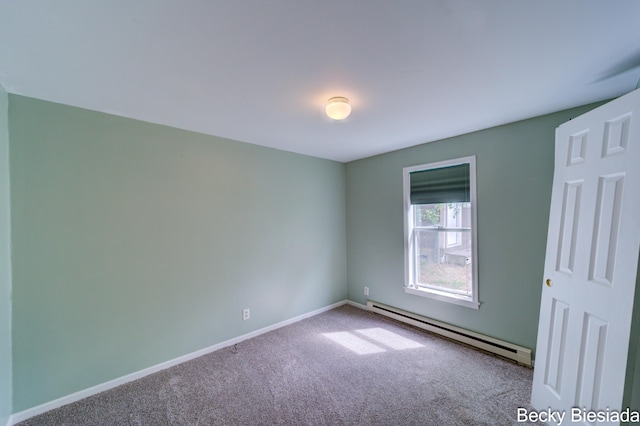 823 Warner St, Whitehall, MI 49461 - unfurnished room featuring a baseboard heating unit, carpet, and baseboards