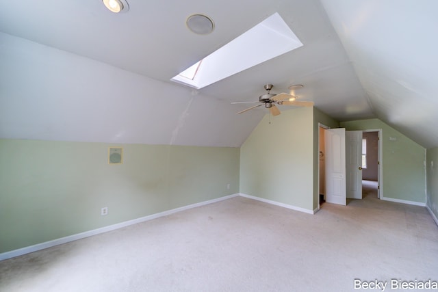 823 Warner St, Whitehall, MI 49461 - additional living space featuring a skylight, carpet, vaulted ceiling, baseboards, and a ceiling fan